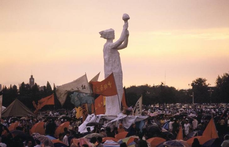 Tiananmen Square protests 19890601 - banners fly while the Goddess of Democracy statue looks on