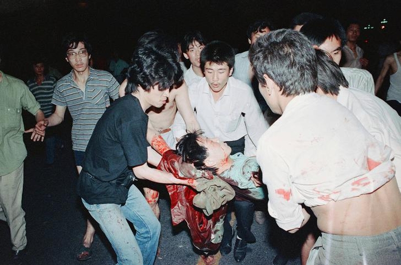 Tiananmen Square protests 19890604 - a wounded protester is carried away