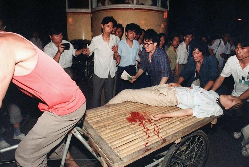 Tiananmen Square protests 19890604 - a wounded protester is carted away