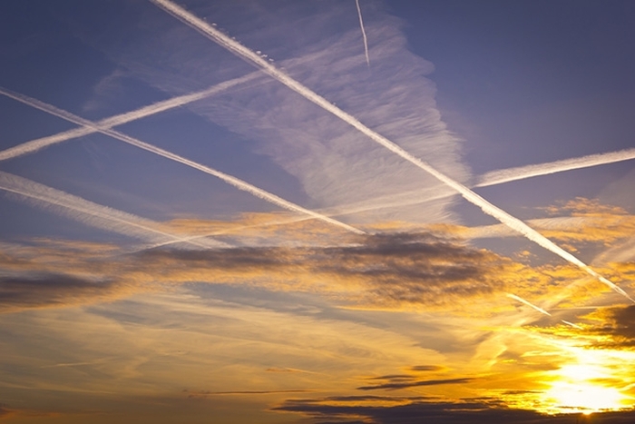 airplane contrails at sunset
