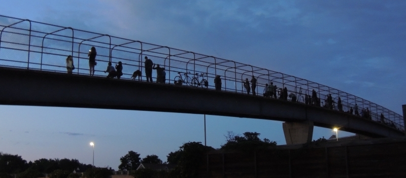 people say good-bye to the 24th St pedestrian bridge over 35W